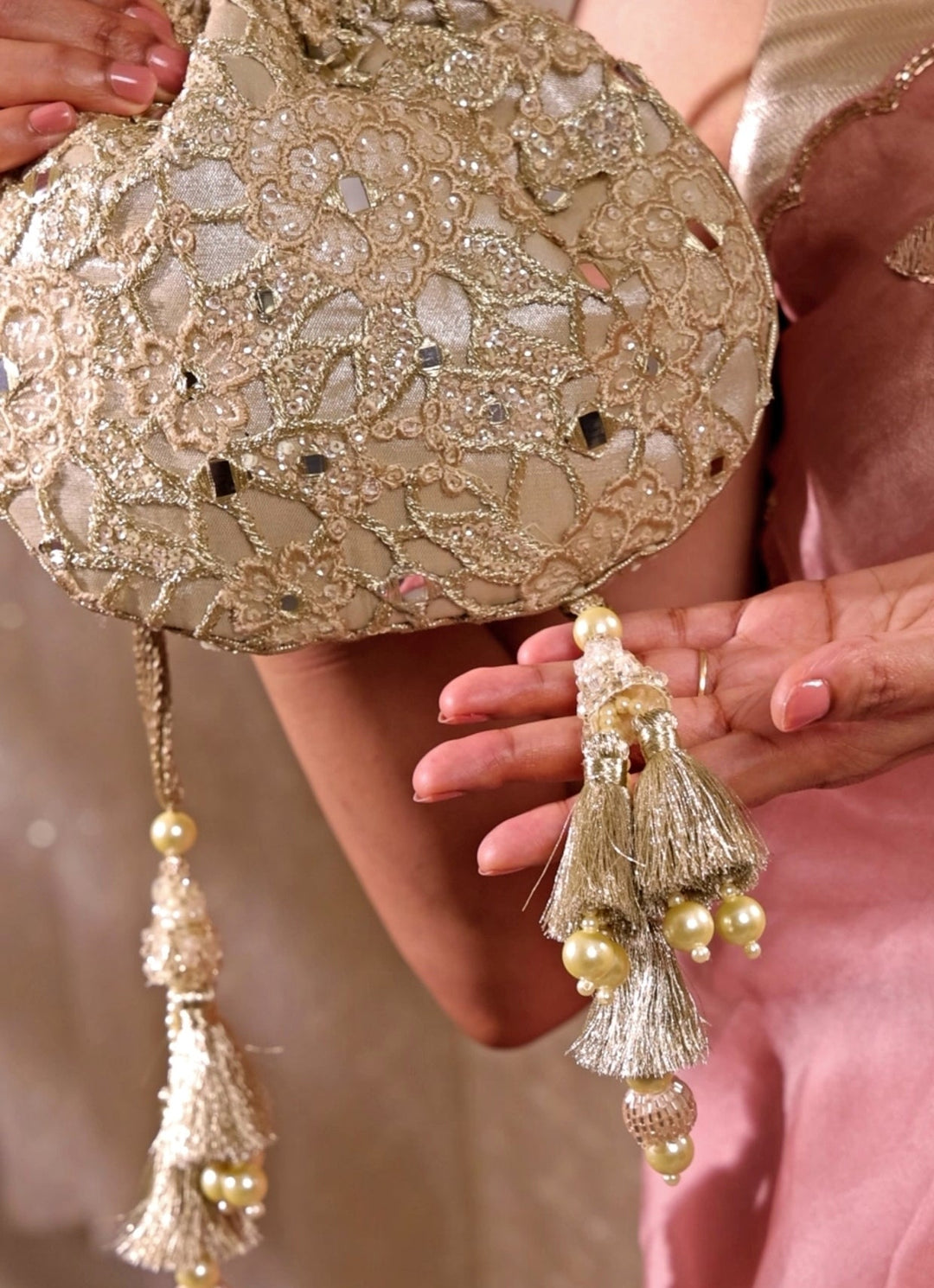 Amyra Gold Embroidered Tissue PotliFabilicious Fashion
