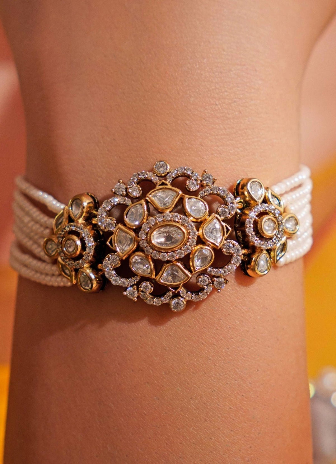 Gold Plated Kundan Crystal Studded Bracelet With White Beads Zevar by Geeta - Fabilicious Fashion