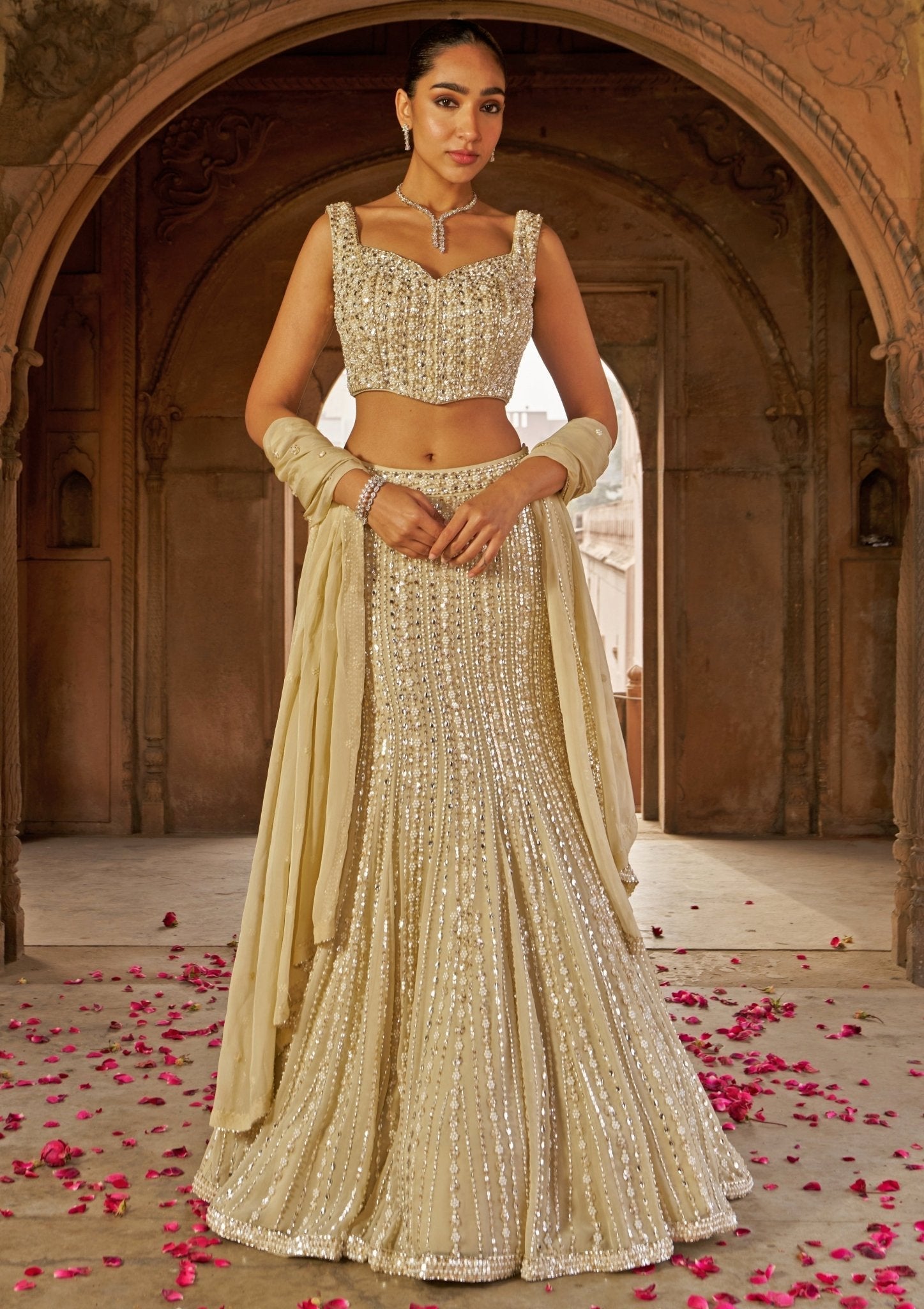 Golden sequin embroidered mermaid lehenga by Nidhika Shekhar