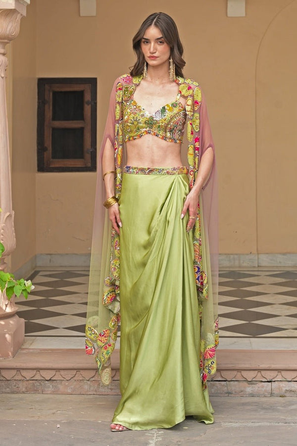 Green and pink satin cowl skirt set with appliqué net cape by Juhi Bengani