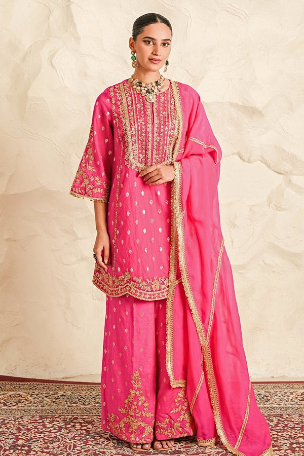 Hot pink booti chanderi kurta sharara set for a wedding ceremony by Nidhika Shekhar