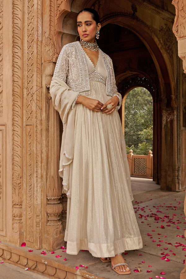 Ivory cape anarkali with floral sequin embroidery for wedding guests by Nidhika Shekhar