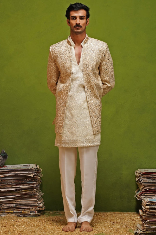 Ivory and gold georgette jodhpuri set for men for an Indian wedding reception by Kalpraag