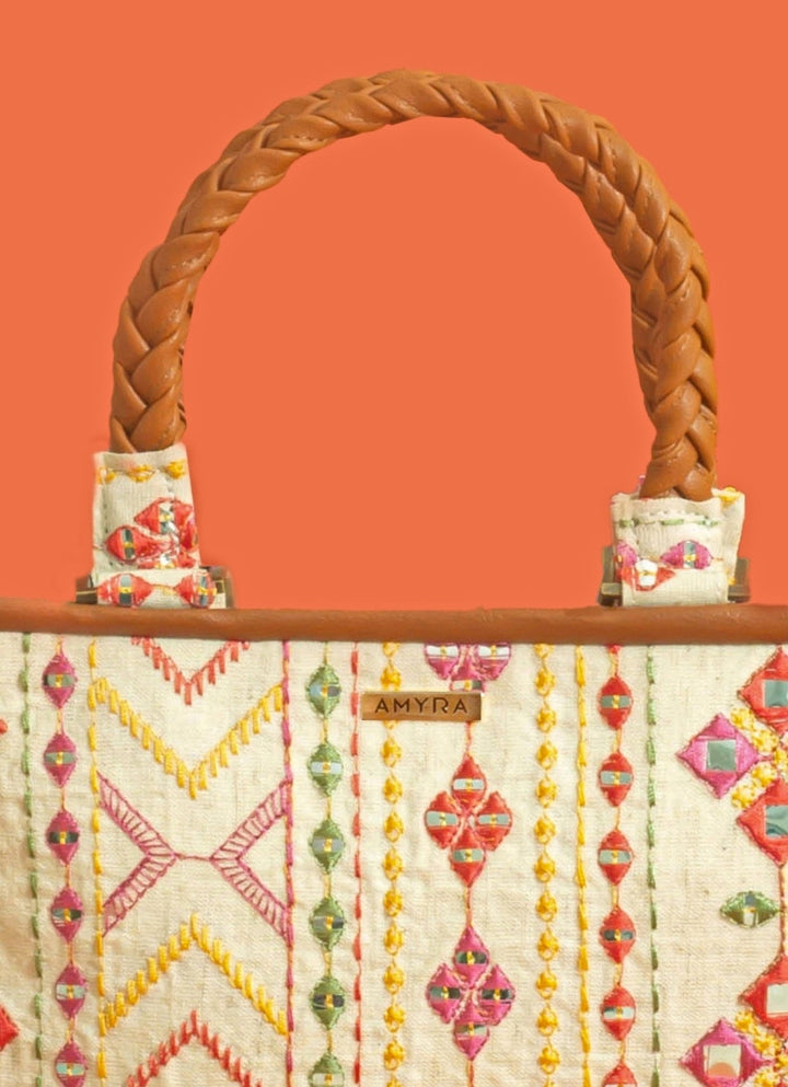 Amyra Ivory And Multicolor Cotton HandbagFabilicious Fashion