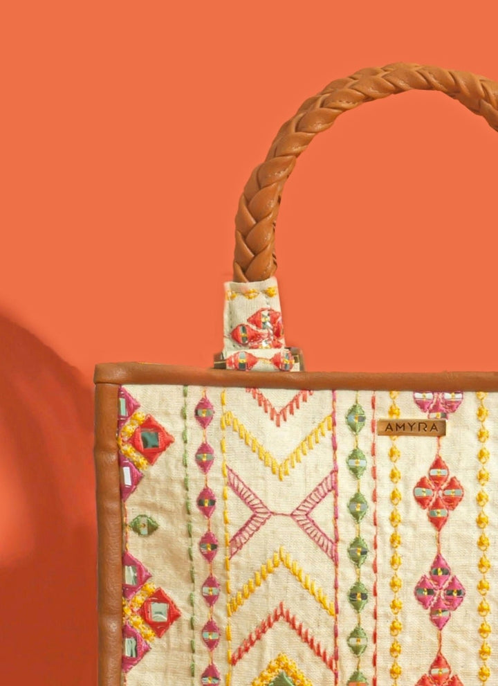 Amyra Ivory And Multicolor Cotton HandbagFabilicious Fashion