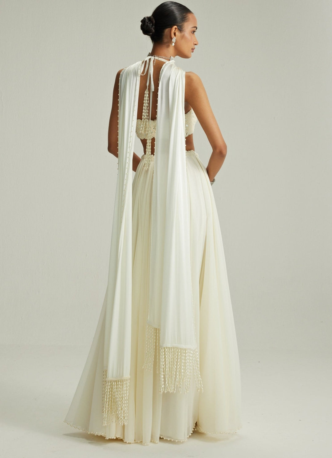 Ivory Embroidered Georgette Lehenga With Halter Blouse Vvani by Vani Vats - Fabilicious Fashion