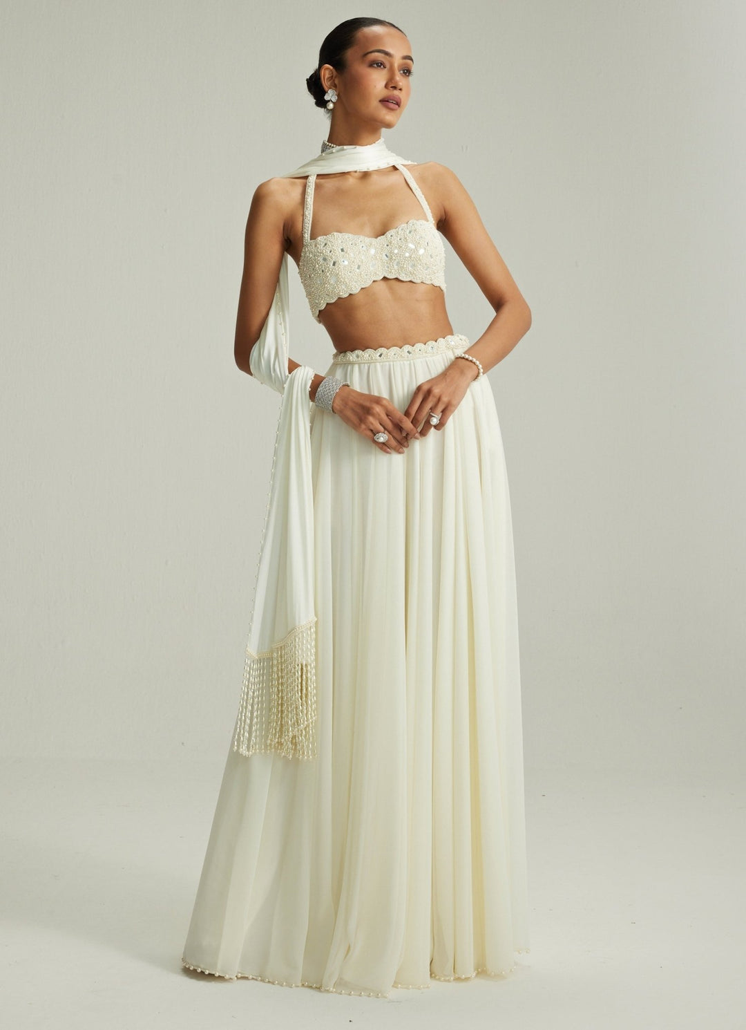 Ivory Embroidered Georgette Lehenga With Halter Blouse Vvani by Vani Vats - Fabilicious Fashion