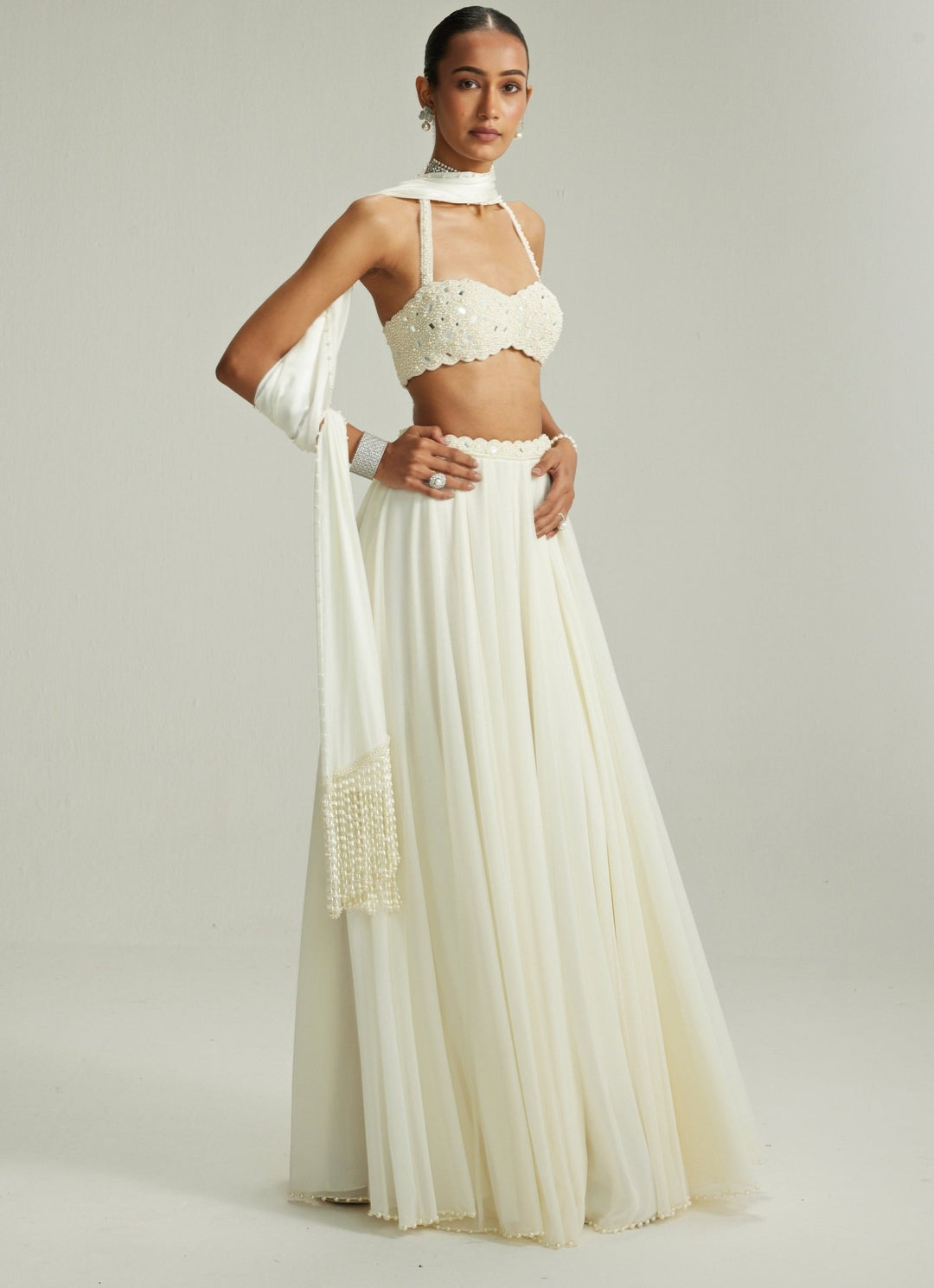 Ivory Embroidered Georgette Lehenga With Halter Blouse Vvani by Vani Vats - Fabilicious Fashion