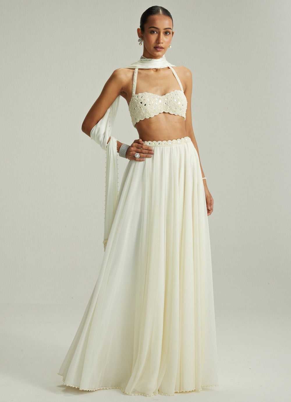 Ivory Embroidered Georgette Lehenga With Halter Blouse Vvani by Vani Vats - Fabilicious Fashion