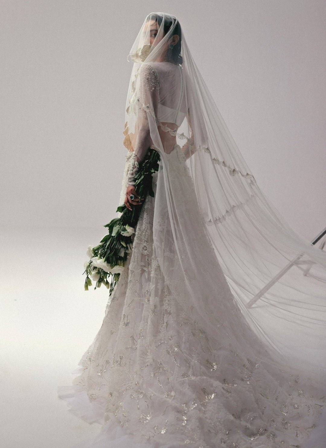 The Little Black Bow Ivory Embroidered Soft Net Bridal Lehenga SetFabilicious Fashion