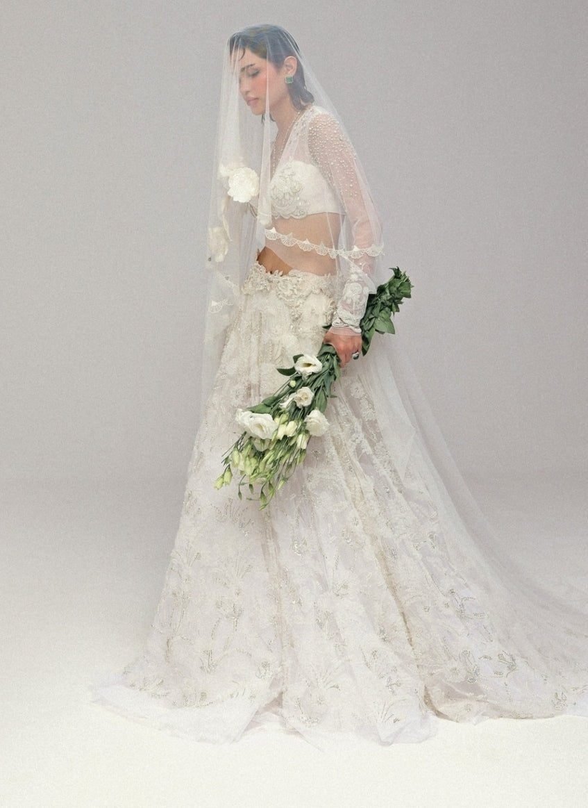 The Little Black Bow Ivory Embroidered Soft Net Bridal Lehenga SetFabilicious Fashion