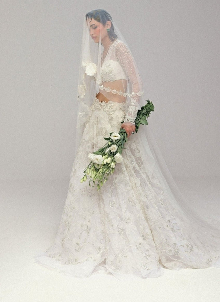 The Little Black Bow Ivory Embroidered Soft Net Bridal Lehenga SetFabilicious Fashion
