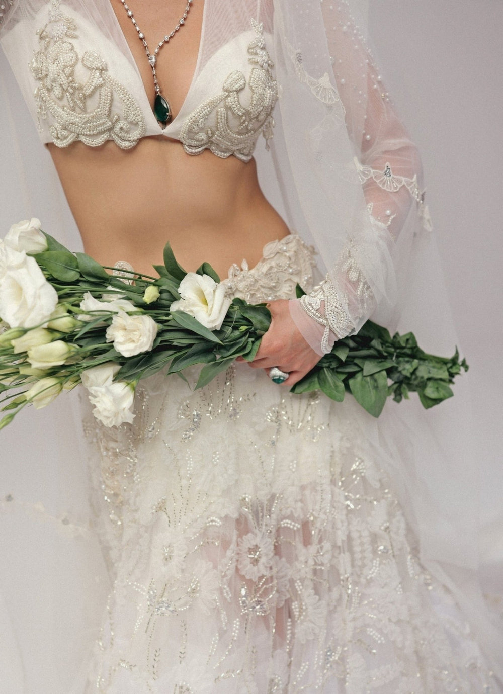 The Little Black Bow Ivory Embroidered Soft Net Bridal Lehenga SetFabilicious Fashion
