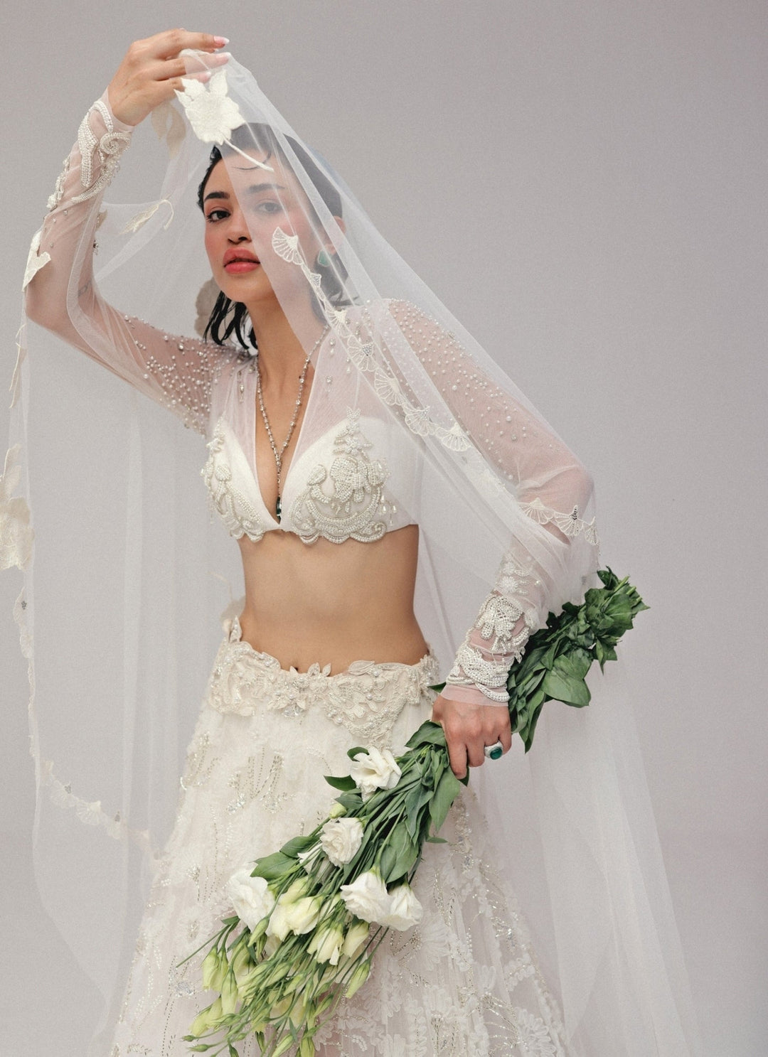 The Little Black Bow Ivory Embroidered Soft Net Bridal Lehenga SetFabilicious Fashion