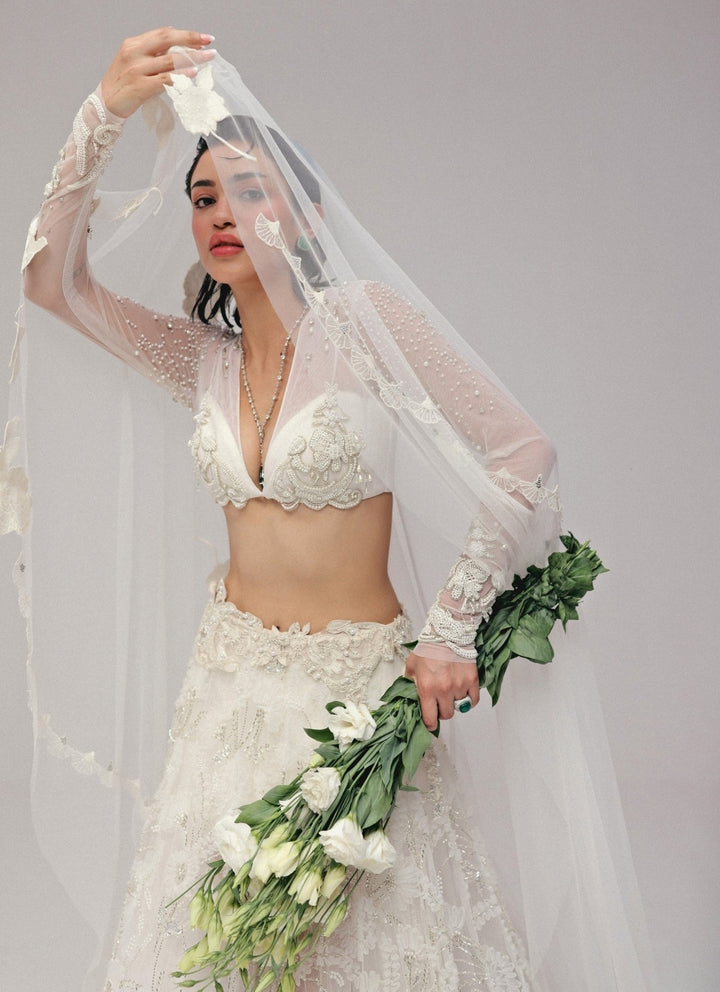 The Little Black Bow Ivory Embroidered Soft Net Bridal Lehenga SetFabilicious Fashion