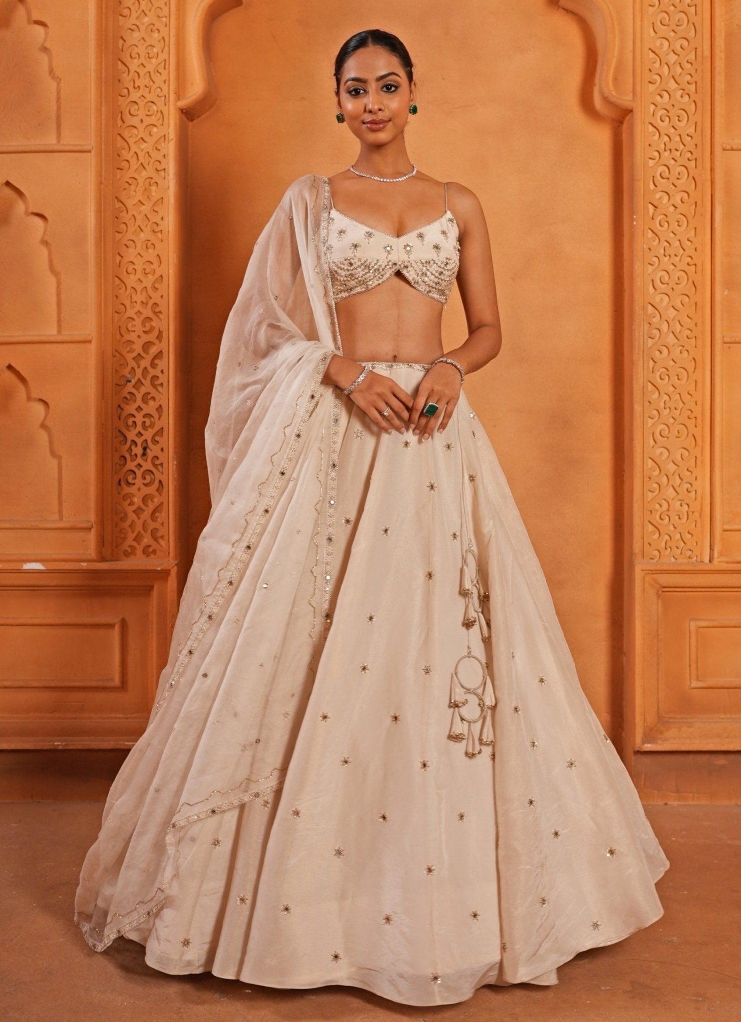 Ivory embroidered zari silk lehenga — best lehenga color for neutral skin tone by Enamour by Radha