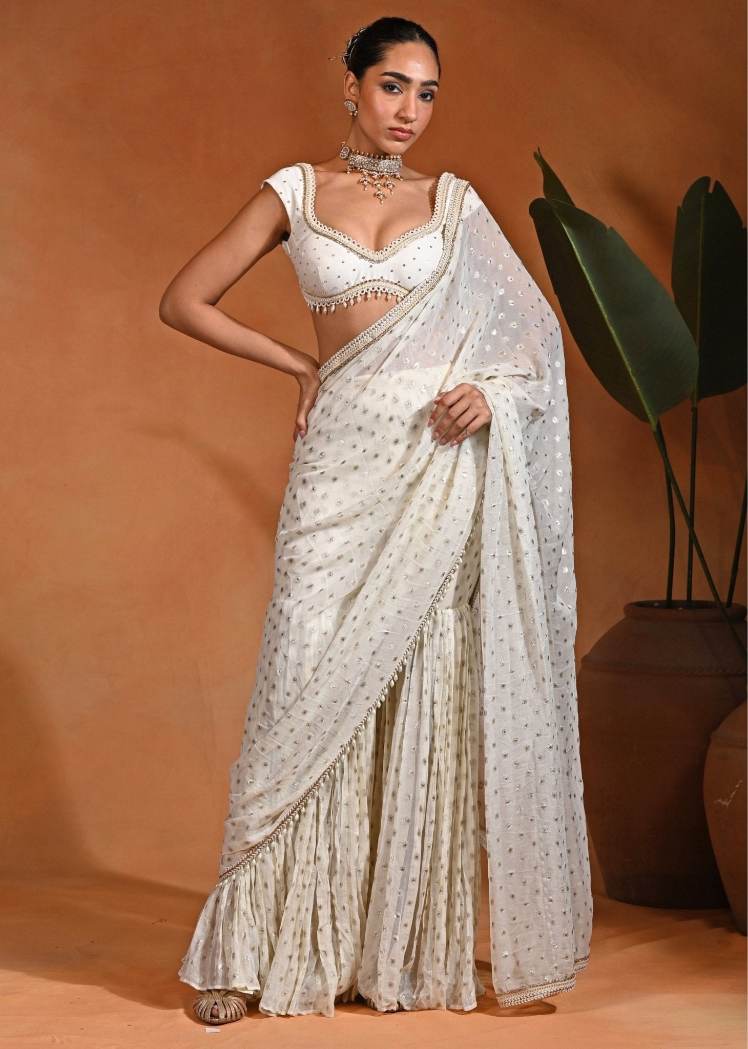 Ivory Georgette Pre-Draped Pant Saree Set by Rishi and Vibhuti for a wedding guest