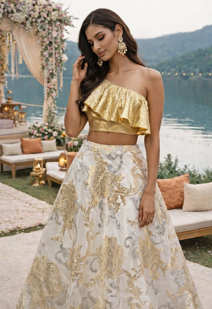 Ivory Jacquard Lehenga With Gold One Shoulder Ruffle Blouse Shrena Hirawat - Fabilicious Fashion