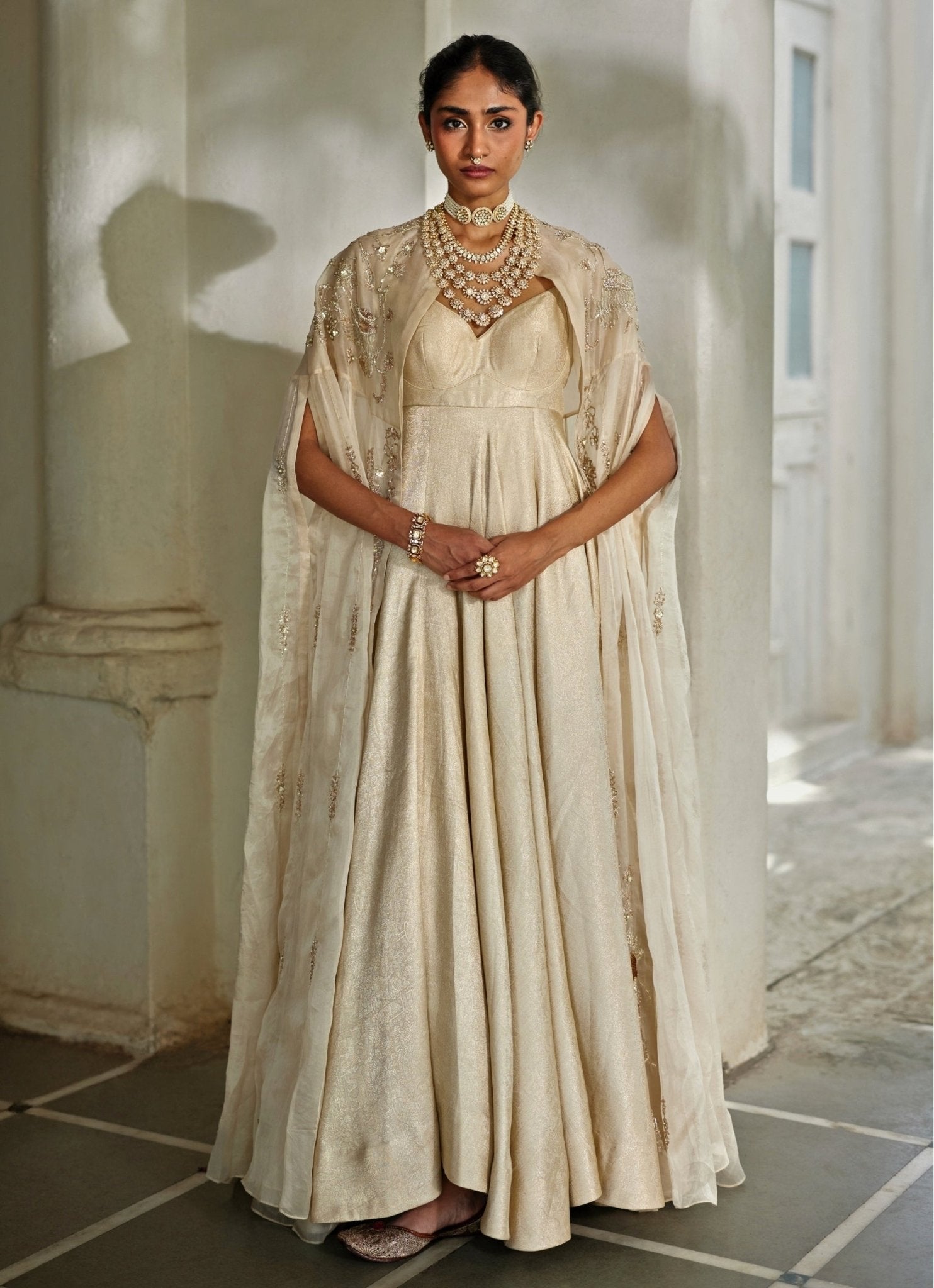 Ivory jamavar jacquard anarkali with cape — Eid kurta set by Paulmi and Harsh