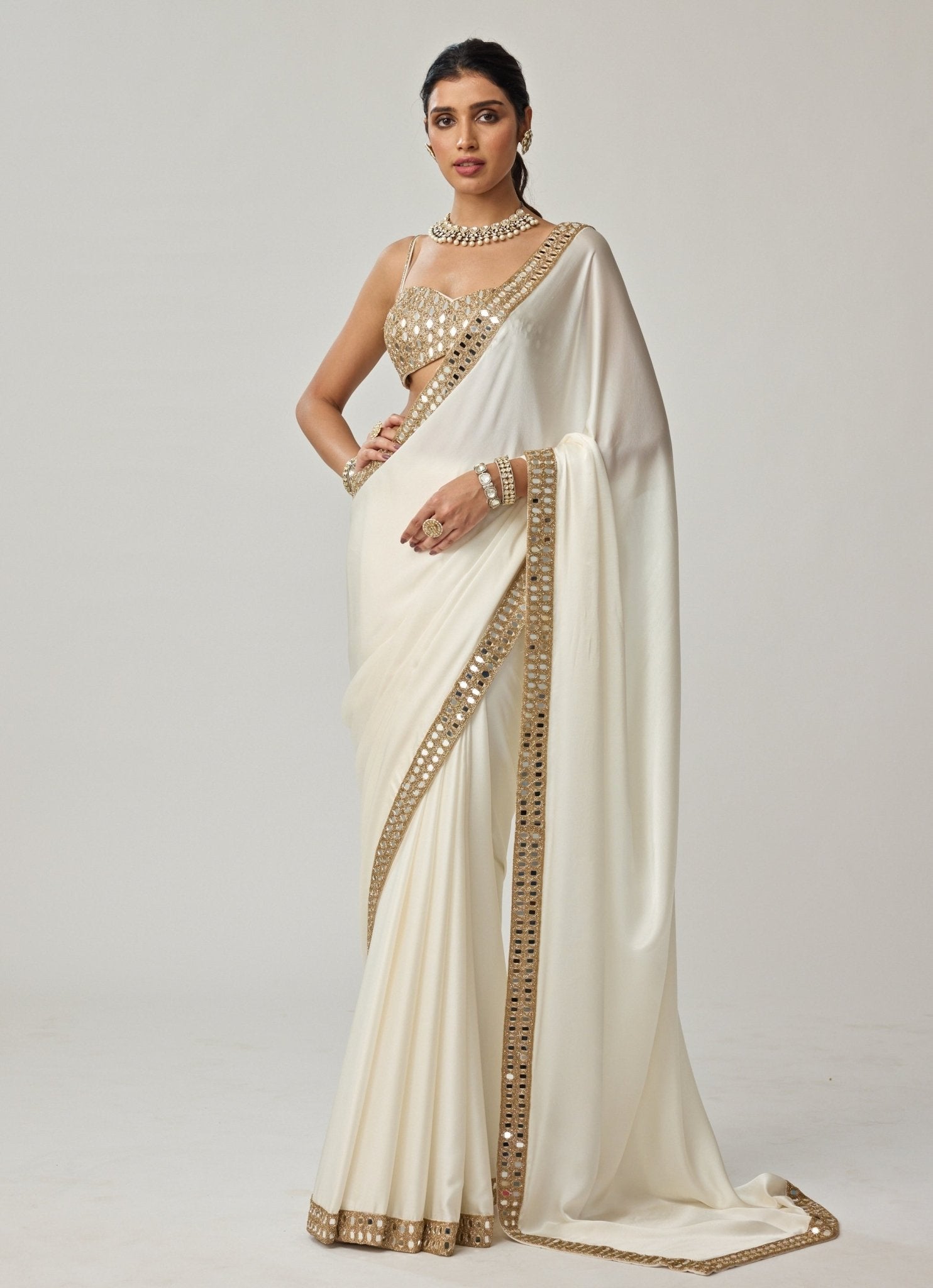 Ivory satin saree with mirror embroidery on georgette blouse