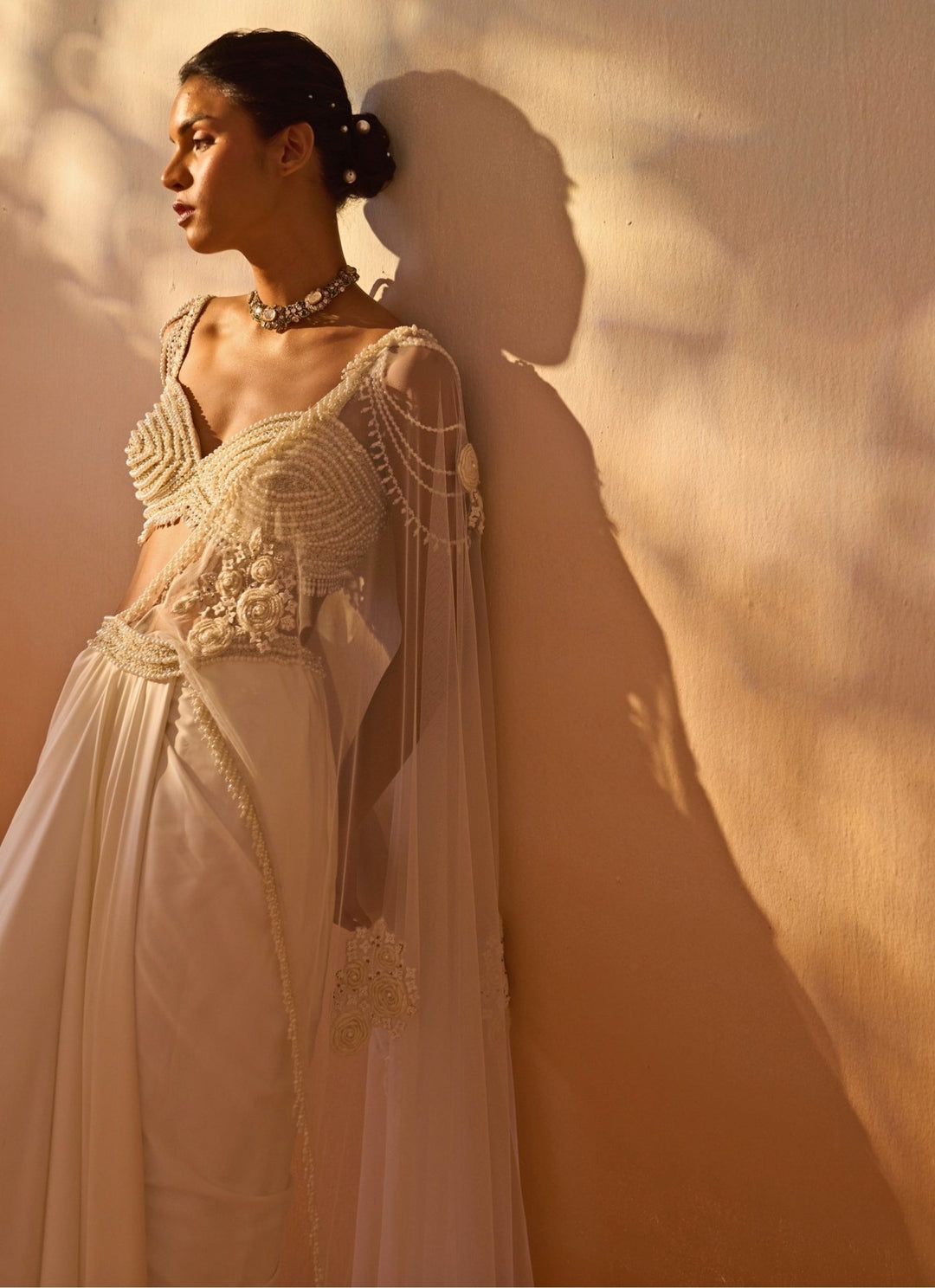 Nitika Gujral Ivory Satin Pre-Draped Saree With Pearl BustierFabilicious Fashion