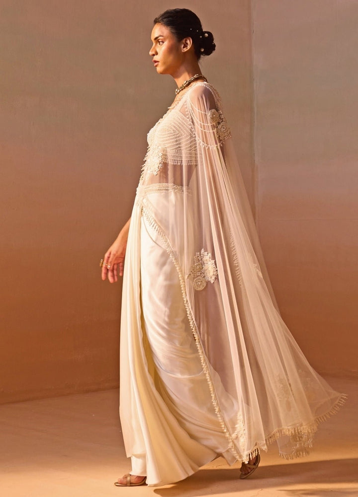 Nitika Gujral Ivory Satin Pre-Draped Saree With Pearl BustierFabilicious Fashion