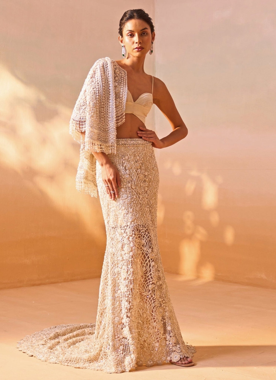 Nitika Gujral Ivory Soft Net Mermaid Trail Skirt Set With JacketFabilicious Fashion