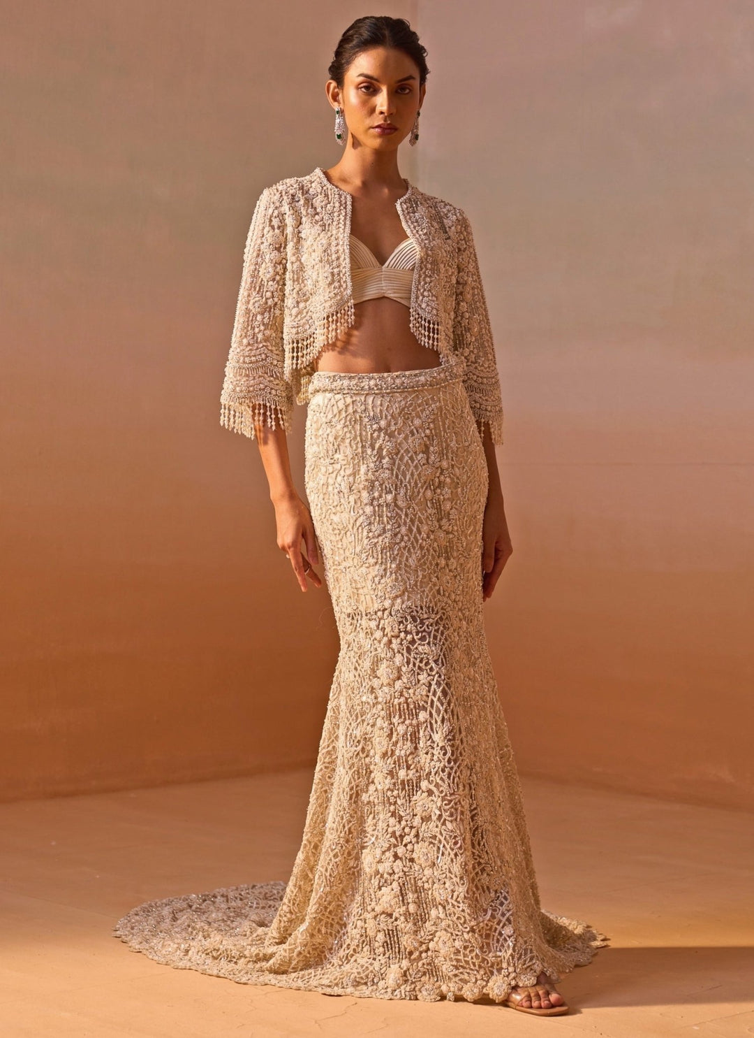 Nitika Gujral Ivory Soft Net Mermaid Trail Skirt Set With JacketFabilicious Fashion