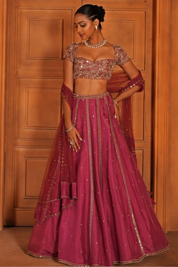 Magenta pink embroidered silk lehenga for a London wedding reception
