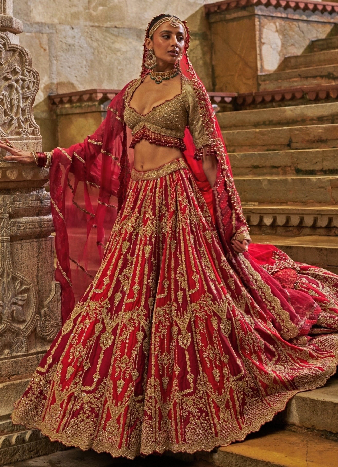 Maroon red raw silk bridal lehenga by Nitika Gujral