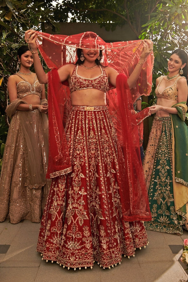 Maroon red raw silk sequinned panelled bridal lehenga set by Jigar and Nikita