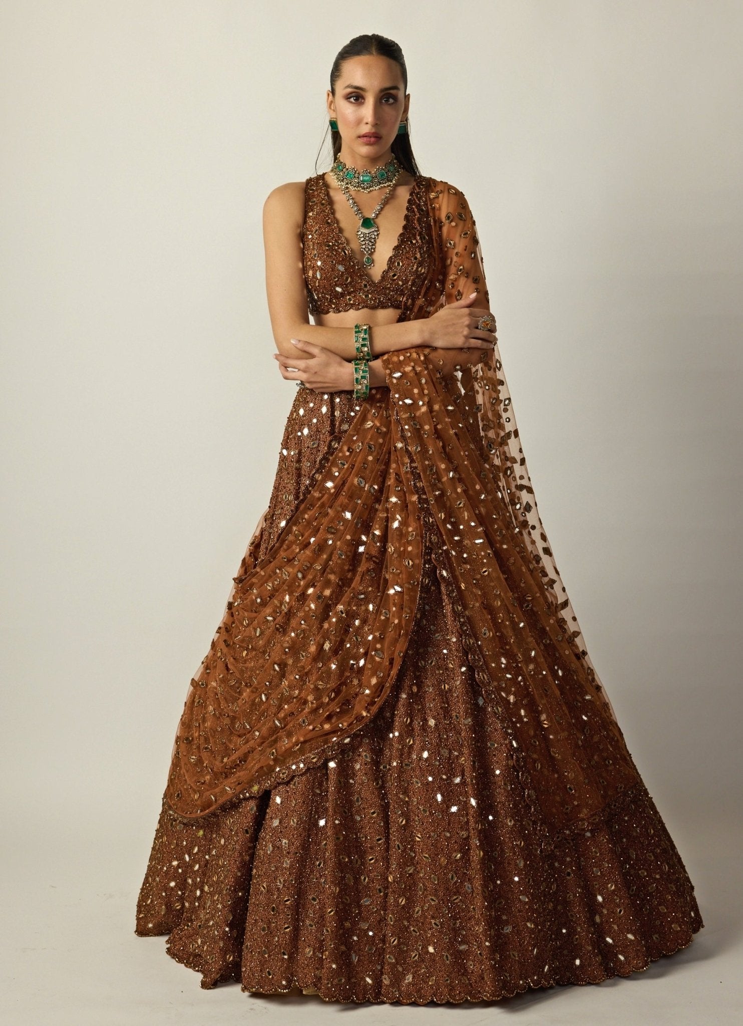 Metallic copper embroidered organza lehenga set by Vvani by Vani Vats