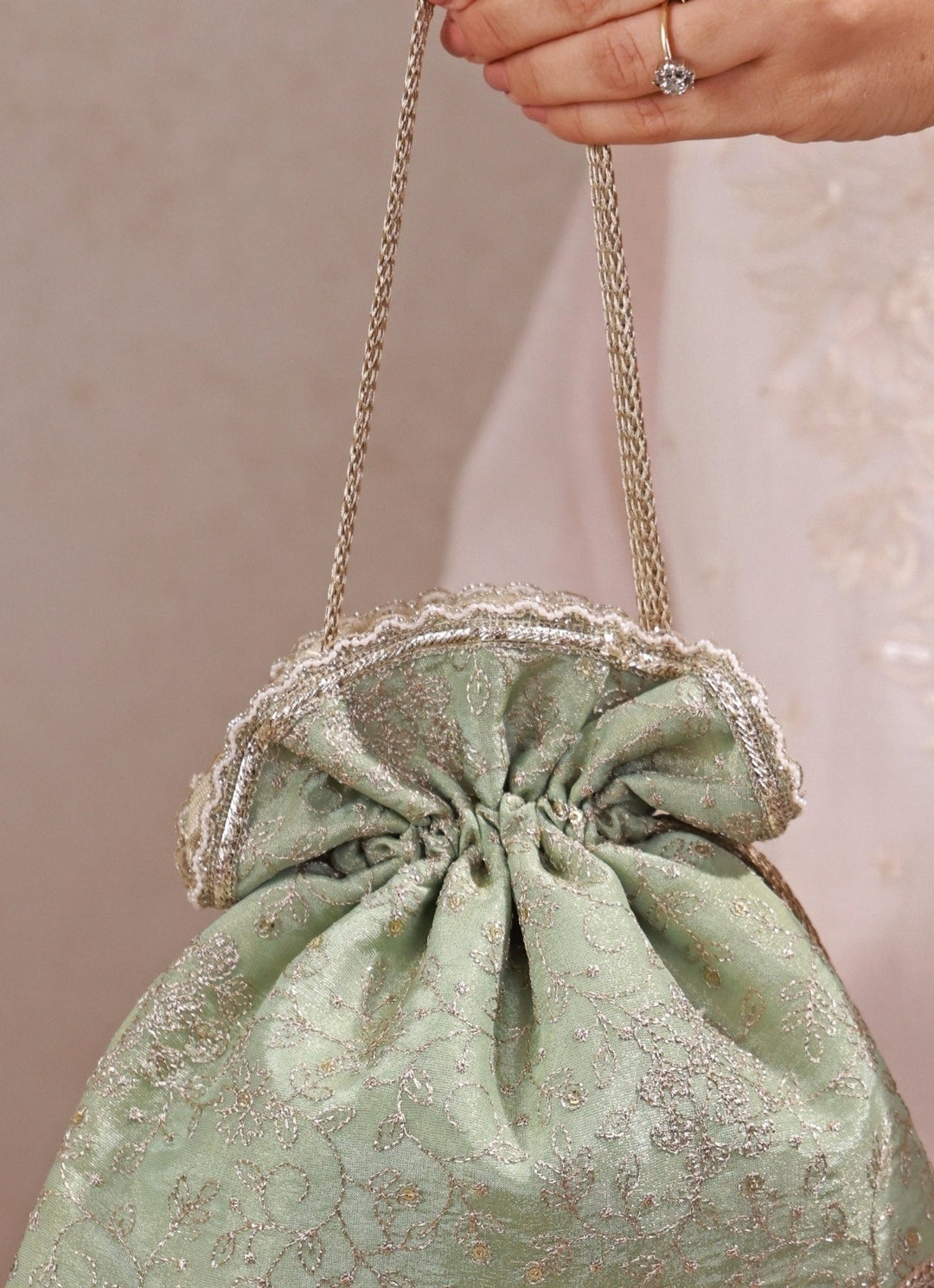 Amyra Mint Green Embroidered Tissue Silk PotliFabilicious Fashion
