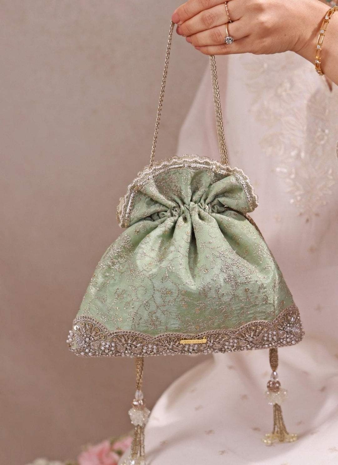 Amyra Mint Green Embroidered Tissue Silk PotliFabilicious Fashion