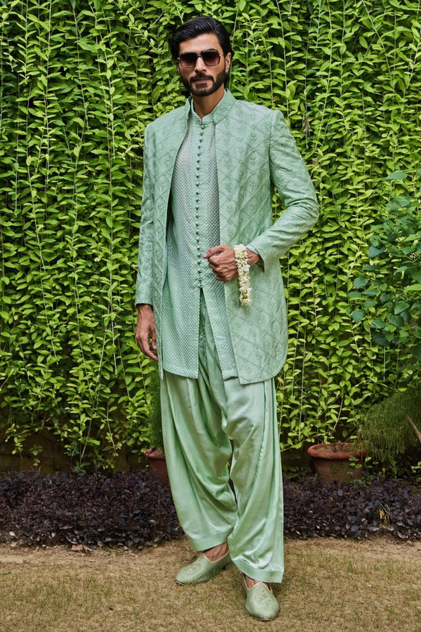 Mint green raw silk Jodhpuri jacket set by Nitika Gujral Men for the brother of the bride at an Indian wedding