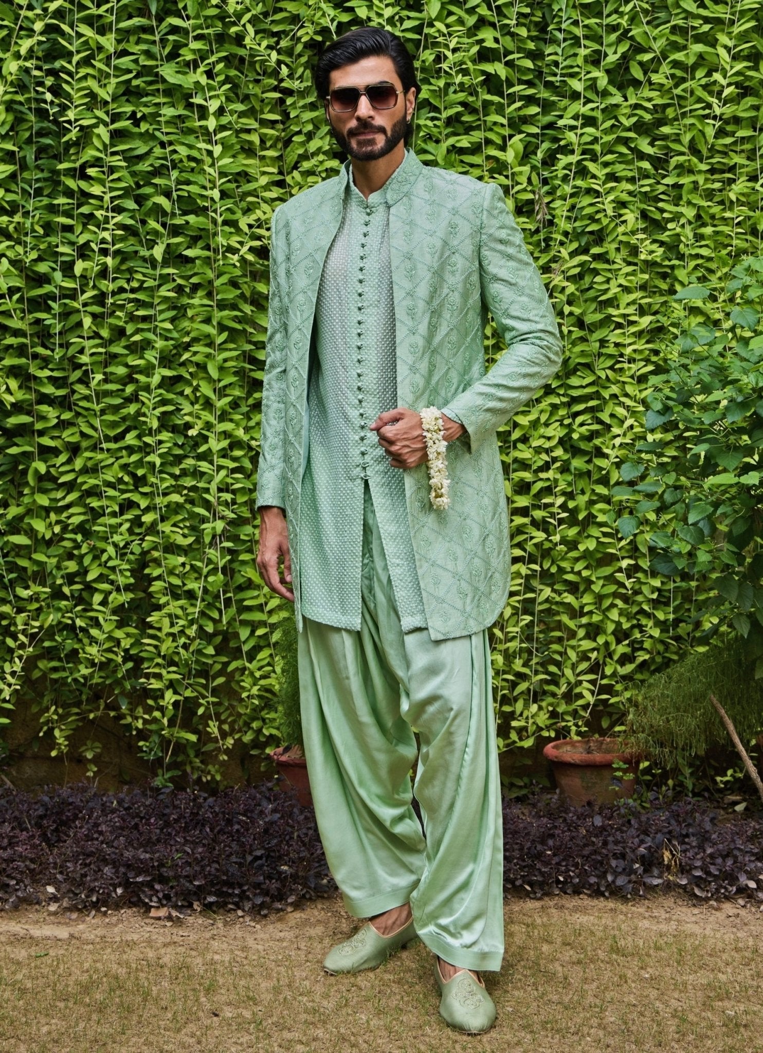 Mint green raw silk Jodhpuri jacket set for a sangeet, indo-western for men by Nitika Gujral Men, made to measure