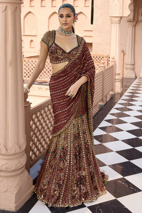 Mocha brown crepe lehenga saree set by Nidhika Shekhar for the mother of the groom at an Indian wedding reception