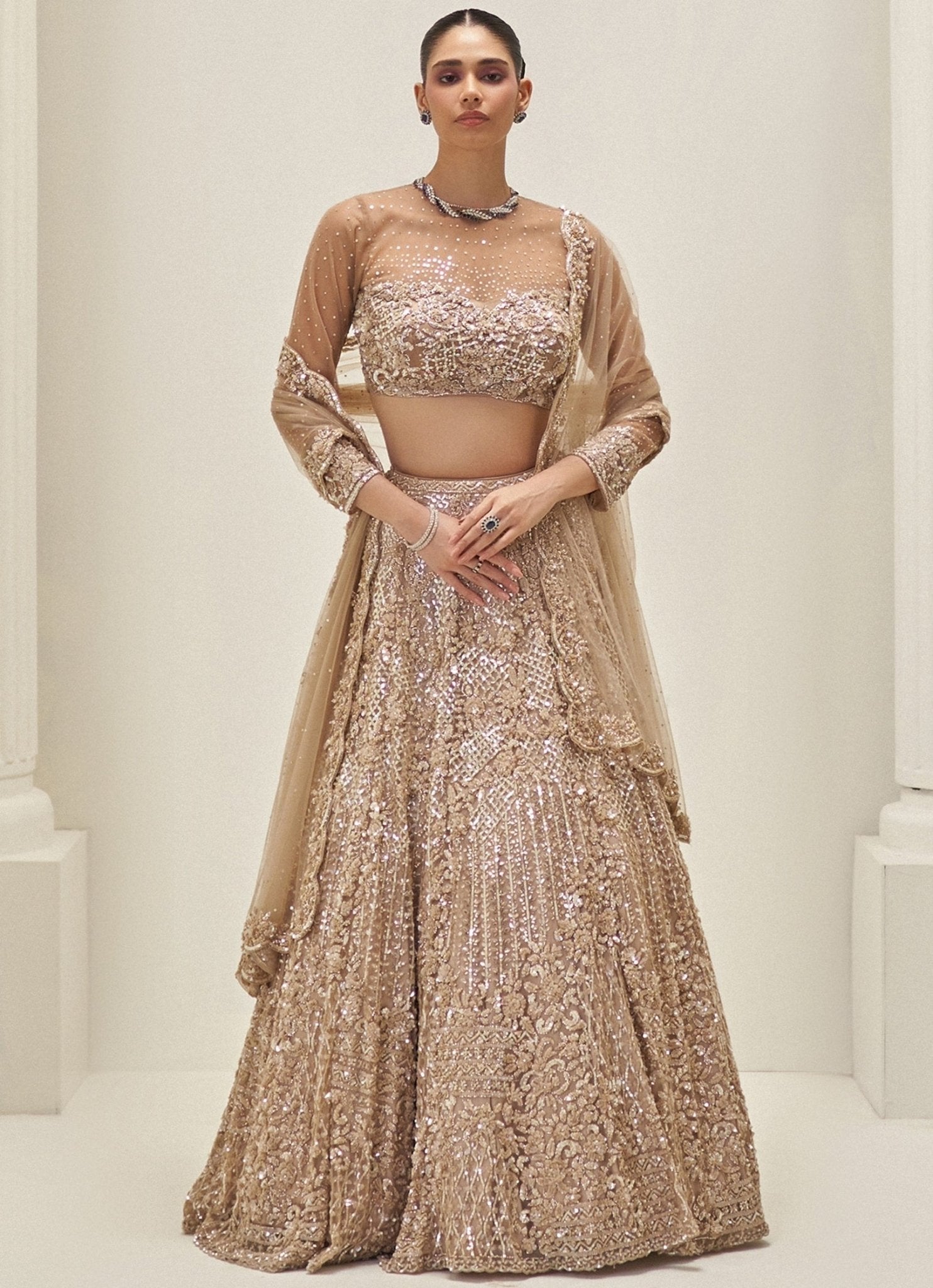 Gold palette nikaah bridal colours — molten gold net lehenga for a formal nikaah ceremony and reception photos