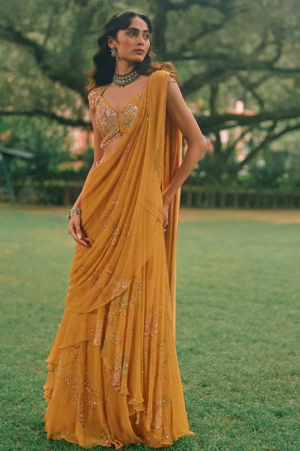 Paulmi and Harsh mustard yellow printed chiffon pre-draped saree for a Diwali card party
