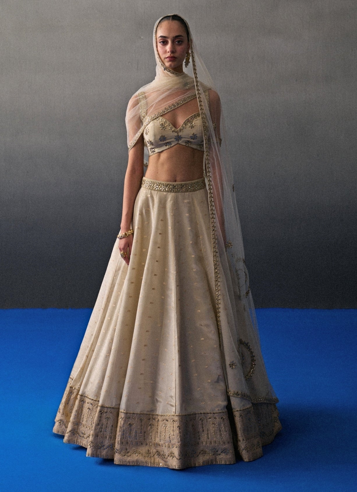 Muted gold Banarasi silk bridal lehenga by Angad Singh