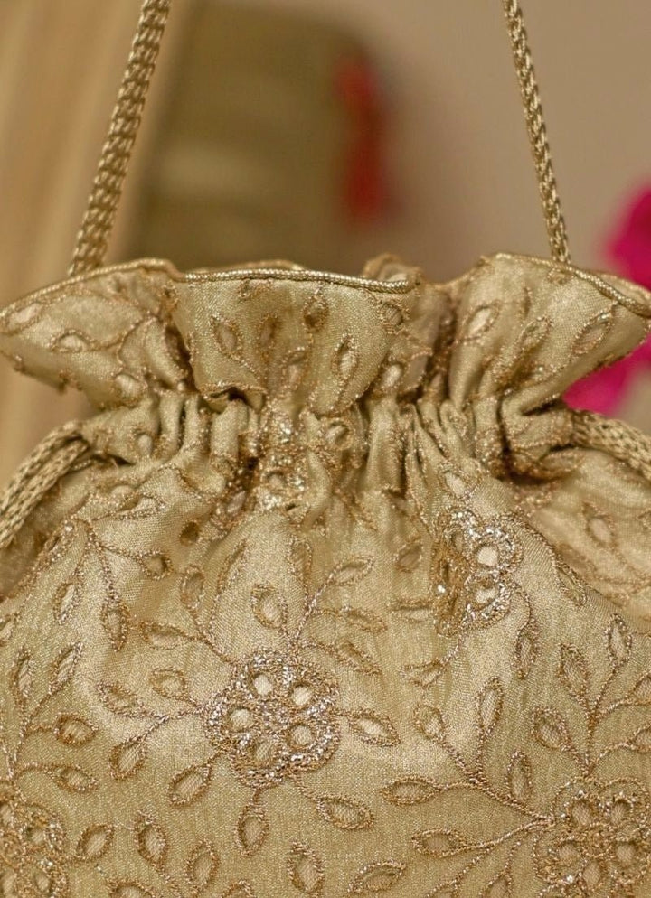 Amyra Muted Gold Embroidered Tissue PotliFabilicious Fashion