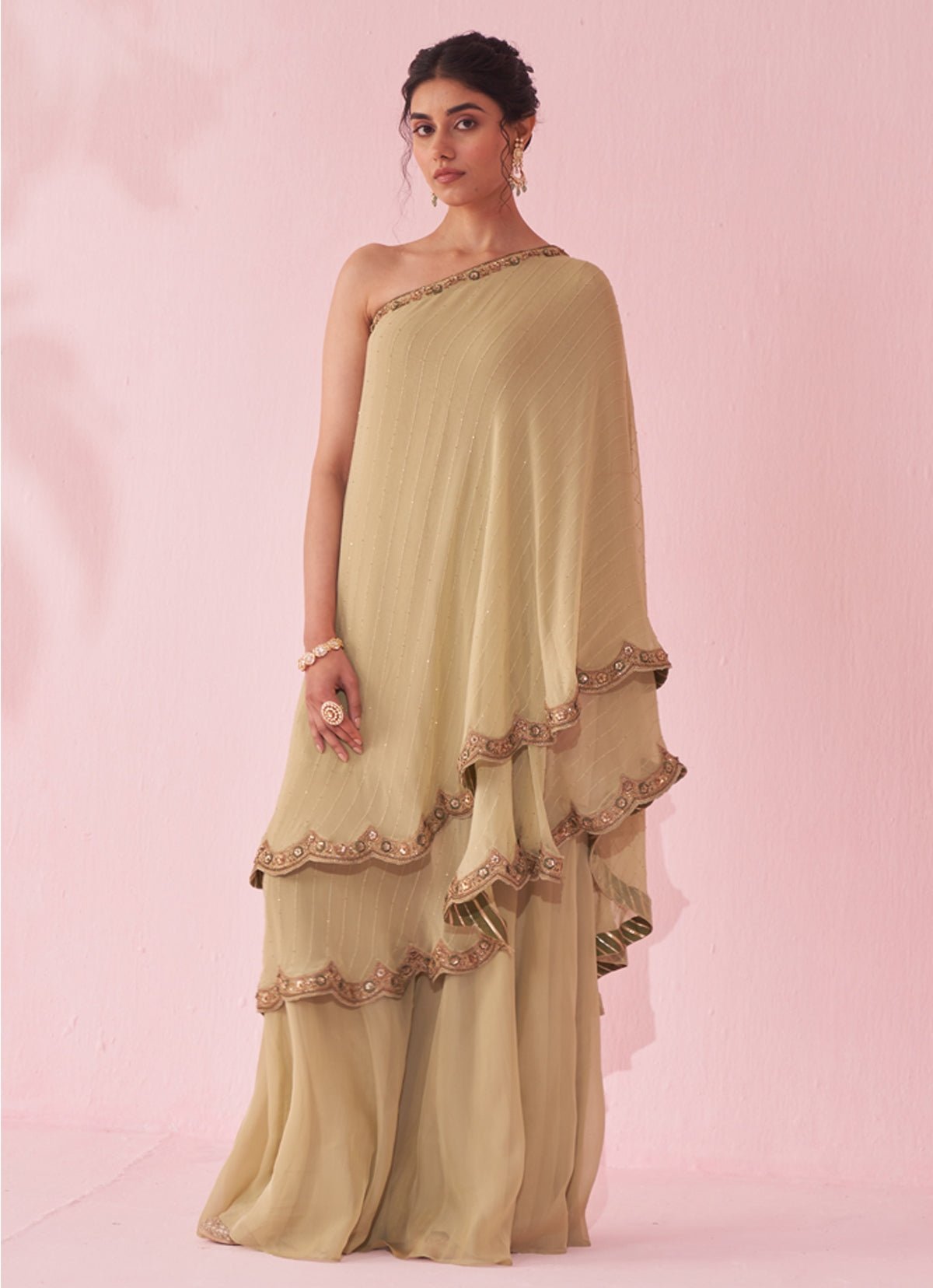 Muted green one-shoulder kurta sharara set for a modern Mehendi guest