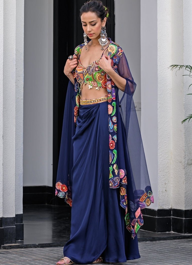 Navy Blue Satin Dhoti Skirt With Embroidered Blouse And Cape Juhi Bengani - Fabilicious Fashion