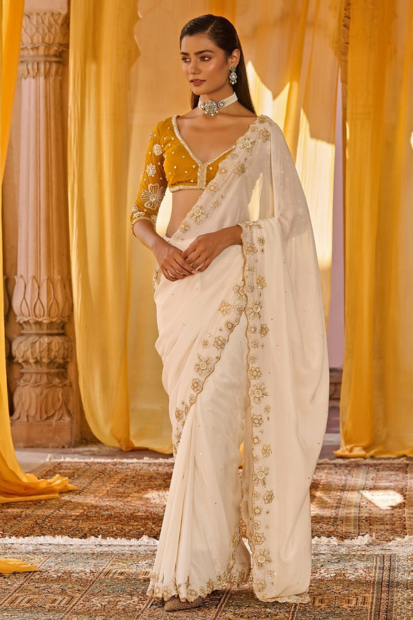 Off-white embroidered chiffon saree for an elegant family lunch
