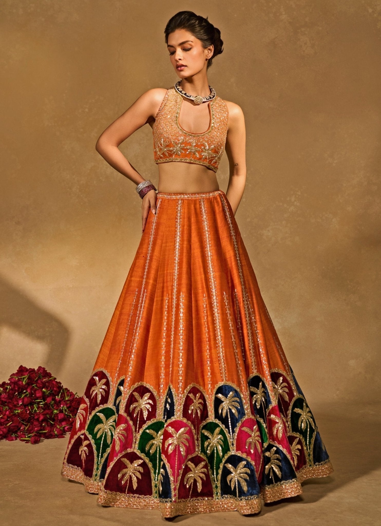 Orange raw silk lehenga for mehendi London by Chamee and Palak