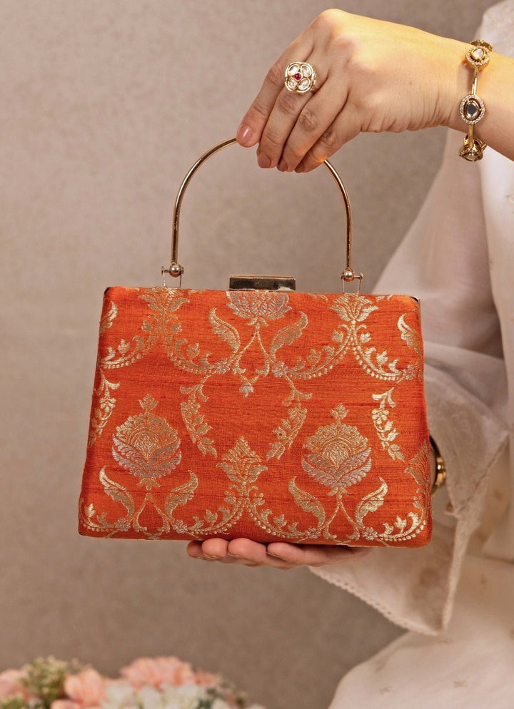 Amyra Orange Raw Silk Top Handle ClutchFabilicious Fashion