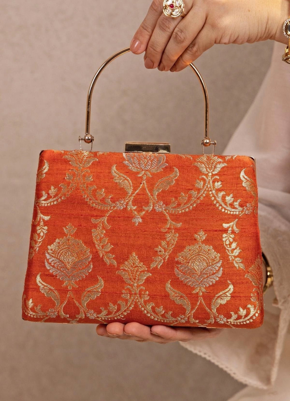 Amyra Orange Raw Silk Top Handle ClutchFabilicious Fashion