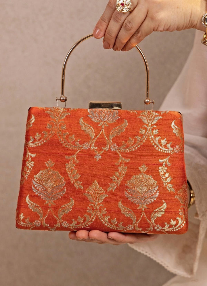 Amyra Orange Raw Silk Top Handle ClutchFabilicious Fashion