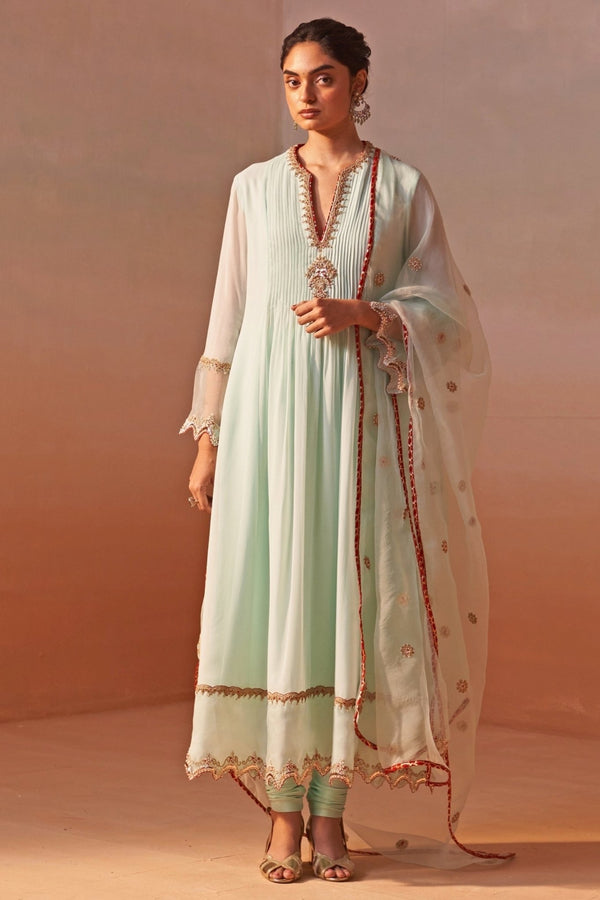 Nitika Gujral pastel green georgette anarkali set for mother of the bride at a puja