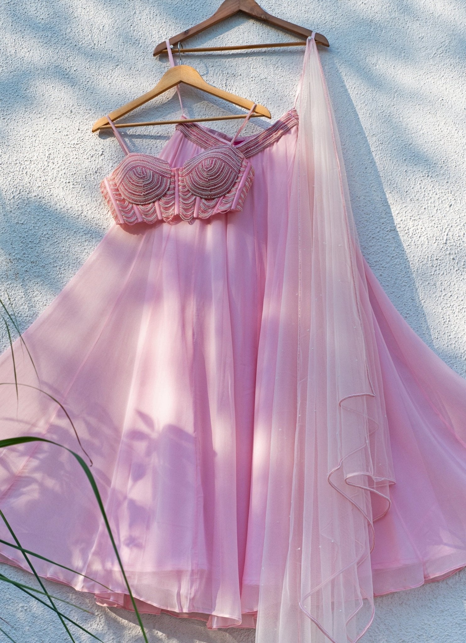 Pastel pink georgette sharara with pearl blouse for an engagement party by Anisha Shetty